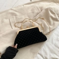 Detail of black velvet evening bag with silver crystals and gold metal handle - Black
