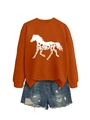 Detailed view of caramel orange sweatshirt featuring white horse silhouette and floral print - Burnt Orange (White Print)