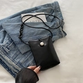 Mini black crossbody phone bag with a large pearl button and slim shoulder strap - Black