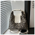 Detail of leopard print canvas tote bag with white leather flap and silver buckle - White
