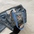 Vintage floral jacquard crescent bag in off-white with adjustable blue shoulder strap - Light Blue