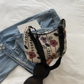 Floral print crescent shoulder bag in cream with colorful vintage patterns and black strap - Black