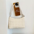 Minimalist soft bubble textured crossbody bag in cream white with knot strap detail - Off White