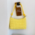 Minimalist bright yellow bubble texture tote bag with knotted strap and metal ends - Yellow