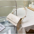 Creamy white flap baguette bag with knotted leather strap and gold hardware accents - White