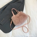 Pink faux fur handbag with shoulder strap and plush texture for a trendy winter style - Pink