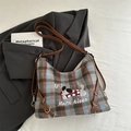 Rucksack aus kariertem Wollstoff mit braunem Lederriemen und Cartoon-Hund-Druck - Blau