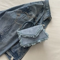 Light blue denim handbag with frayed tassel trim and silver chain strap for women - Blue