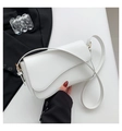 Minimalist white leather crossbody bag with asymmetrical flap and gold hardware accents - White
