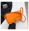 Vibrant orange shoulder bag with asymmetric flap and golden hardware details - Orange Red