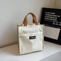 Borsa tote in tela bianca con manici marroni ed etichetta fashion centrale - Bianco Sporco