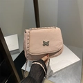 Pink faux leather crossbody bag with silver butterfly clasp and chain strap - Pink