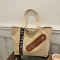 Large beige canvas tote bag with black branded strap and leather-trimmed zip pocket - Khaki