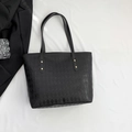 Stylish black quilted tote bag with golden rivets and large capacity for daily commute - Black