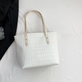 Stylish white tote bag with quilted diamond pattern and golden metal rivet hardware - White