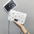 White geometric pattern crossbody bag with black metal turn-lock and chain strap - White