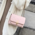 Chic pink quilted crossbody bag with golden chain strap and metal lock closure - Pink