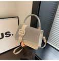 Detail of white leather handbag with silver rhinestone handle and square buckle - Gray