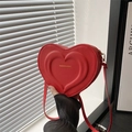 Fashionable red heart-shaped shoulder bag with embossed design and gold metal hardware - Red