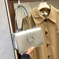 Silver wrinkled faux leather chain bag with a circular rhinestone floral buckle - Silver