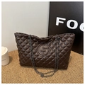 Close-up of brown quilted faux leather tote bag with diamond pattern and chain straps - Brown