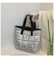 Quilted silver metallic space cotton tote bag with black strap in a minimalist setting - Silver