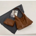 Dark brown faux leather hobo shoulder bag set with matching pouch on grey blazer - Main Bag And Pouch Set / Brown