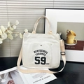 Borsa tote in tela bianca con stampa di lettere nere e tracolla regolabile - Bianco