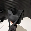 Minimalist black pebbled leather bucket bag with wide strap for crossbody wear - Black