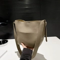 Minimalist grey lychee leather bucket bag with outer pocket and wide shoulder strap - Khaki