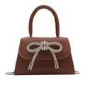 Brown mini crossbody bag with a sparkling rhinestone bow and silver chain strap - Brown