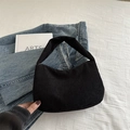 Minimalist black corduroy hobo bag with vertical stripe texture and half-moon shape - Black
