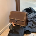 Dark brown retro crossbody bag with gold stud trim and geometric jacquard strap - Brown