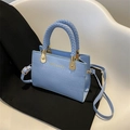 Light blue faux crocodile leather handbag with woven handle and gold hardware - Ice Blue