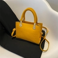 Yellow crocodile pattern handbag with woven handle and adjustable shoulder strap - Yellow