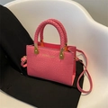 Rose pink crocodile pattern crossbody handbag with woven handle and gold hardware - Pink