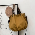 Ginger yellow canvas tote bag with brown leather handles and pleated bottom design - Khaki