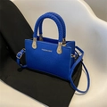 Blue crocodile pattern handbag with woven handles and detachable shoulder strap - Klein Blue