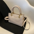 Creamy beige crossbody bag with faux crocodile pattern and elegant braided handle - Off White