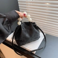 Matte black dumpling bag with large marble bead handle and thin crossbody strap - Black