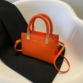 Orange crossbody bag with crocodile texture, braided handles and gold-tone hardware - Orange Red