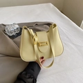 Elegant pale yellow baguette shoulder bag with golden buckle and sleek leather finish - Lemon Green