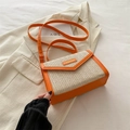 Fashionable straw woven crossbody bag in orange and beige with a top handle - Orange