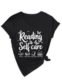 Detail of V-neck T-shirt showing Reading is Self Care text and book illustrations - Black (White Graphic)