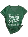 Detail of V-neck cotton T-shirt featuring Reading is Self care print with knot hem - Retro Green (White Graphic)