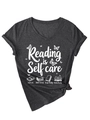 Detail of V-neck charcoal t-shirt featuring Reading is Self care print and butterfly graphics - Heather Grey (White Graphic)