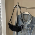 Minimalist black suede crescent croissant bag with knotted shoulder strap detail - Black
