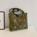 Army green corduroy tote bag featuring white Our Future embroidery in a minimalist style - Green