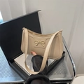 Chic beige underarm bag for women featuring a stylish gold bow metal lock buckle - Khaki
