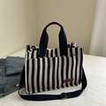 Navy blue and white striped canvas tote bag with adjustable shoulder strap and leather patch - Blue